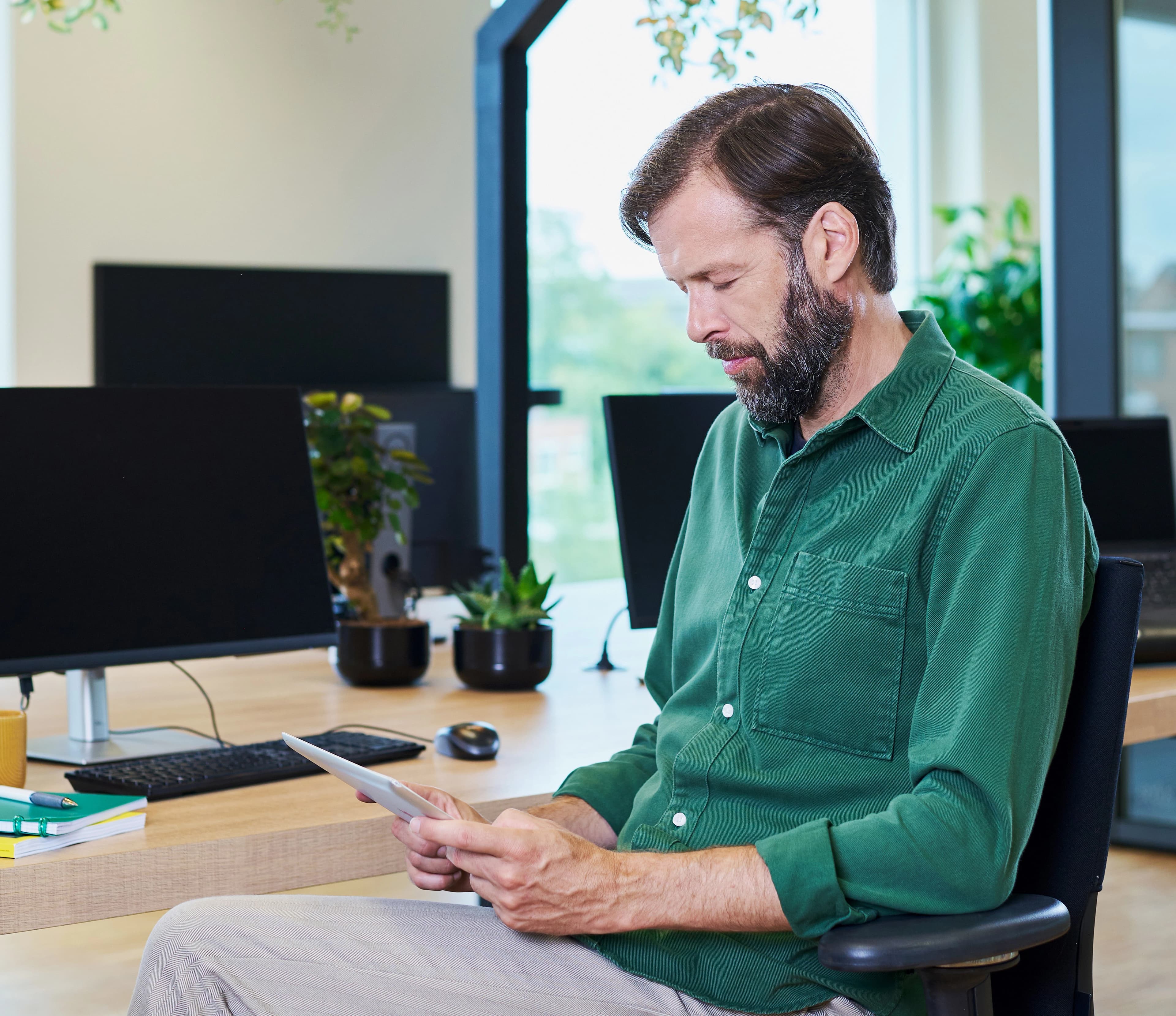 Man looking at tablet